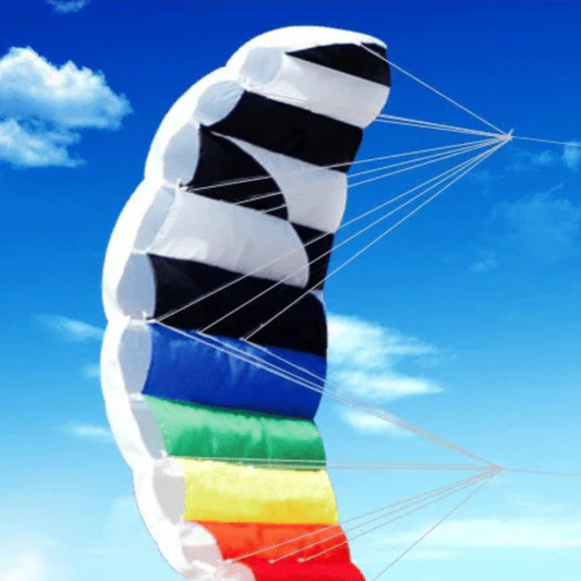 Wikz Parafoil drage i twilight rainbow farver, vist på blå baggrund
